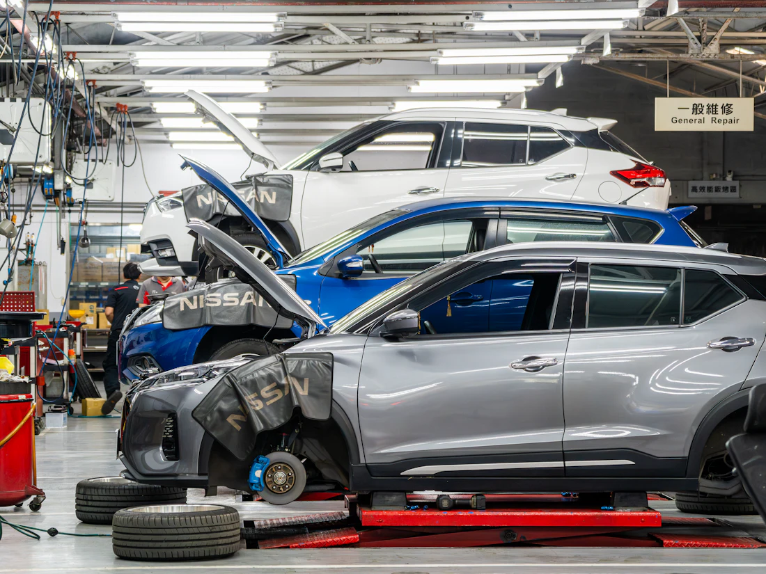 Cars lifted inside a clean auto repair workshop